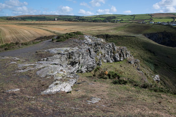 A patchwork of fields viewed over a rock outcrop, Cornwall