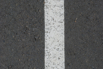 Fototapeta premium New asphalt texture with white line. Top view