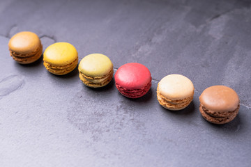 Different types of colourful macaroons in close up, Sweet and colourful french macaroons.