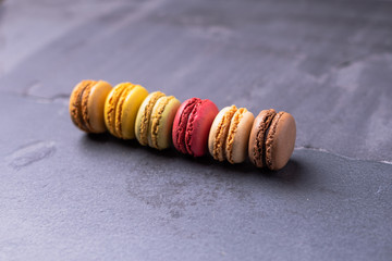Different types of colourful macaroons in close up, Sweet and colourful french macaroons.
