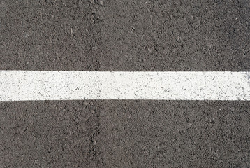Fototapeta premium New asphalt texture with white line. Top view