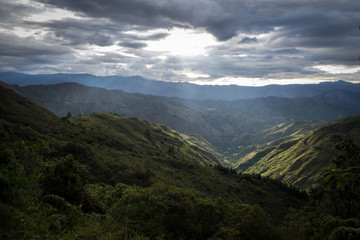Mountainous valley seen from the heights. The sun's rays are appreciated. Latin America