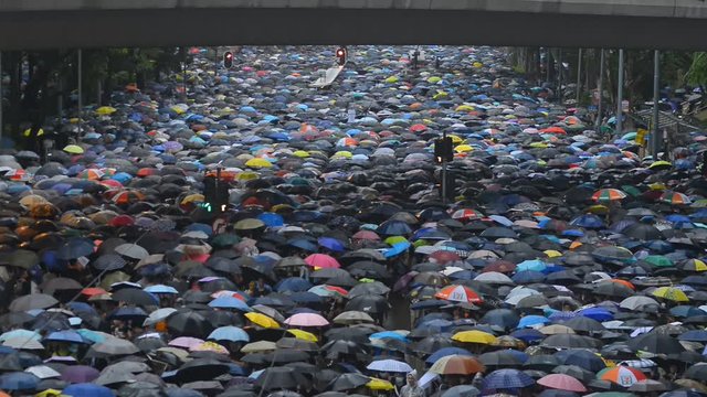 Hongkong, China - August 2019: background top view 2019 asia business people crowd. concept american propaganda woman and asian man protest with umbrella. voice political rally about gdpr resistance