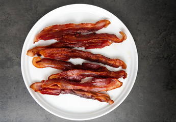 Cooked Bacon Stripes on Dark Background