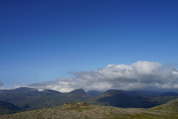 Fototapeta premium Mountain Range Covered in Clouds