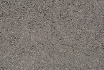 Smooth asphalt road. Tarmac dark grey grainy road background. Top view grunge rough surface