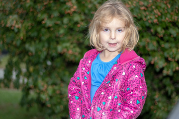 Young girl wearing pink coat