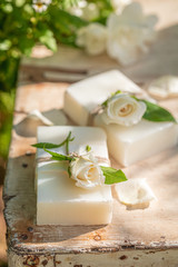 Obraz na płótnie Canvas Handmade and aromatic rose soap made of fresh flowers