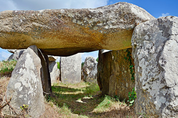 Prehistoric dolmen near megalithic menhirs alignment. Carnac, Brittany. France
