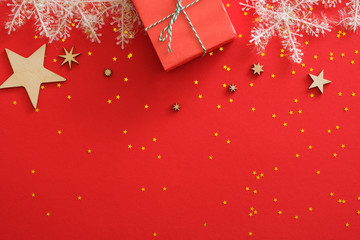 Christmas card mockup. Frame border made of Christmas decorations, gift box, wooden stars, white...