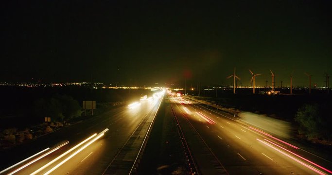 Time-lapse of wind turbines and traffic on I-10 highway in Palm Springs, California
