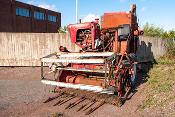Vintage harvester, retro technology. Harvesting equipment of the last century, the history of farming.
