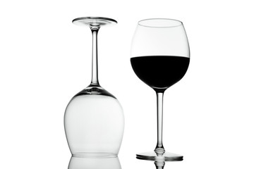 Empty Crystal wine glasses with wine isolated on white background. Alcohol beverage card backdrop.