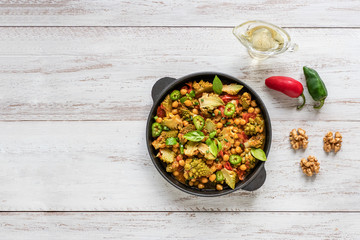 Nutty roasted romanesco curry in a iron frying pan.