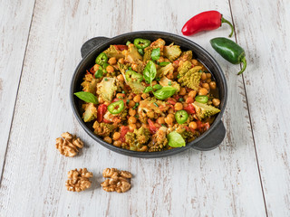 Nutty roasted romanesco curry in a iron frying pan.