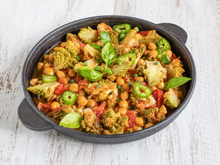 Nutty roasted romanesco curry in a iron frying pan.