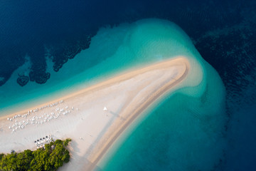 Aerial view of Zlatni Rat, Golden Cape, Brac Island, Croatia. Top view on summer beach travel in Adriatic Sea. Drone photo. Traveling concept.