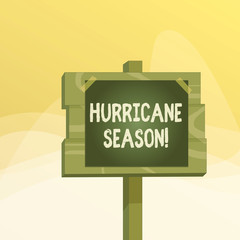 Writing note showing Hurricane Season. Business concept for time when most tropical cyclones are expected to develop Wood plank wood stick pole paper note attached adhesive tape