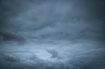 background of a stormy sky full of dark clouds - obrazy, fototapety, plakaty
