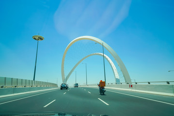 Lusail Expressway Memorial Arches crossing the highway interchange in Doha Qatar.