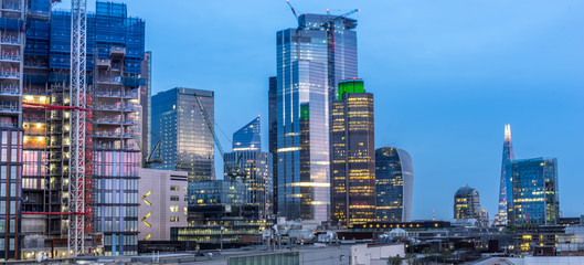 Fototapeta na wymiar London skyline including skyscrapers, city escape after dusk