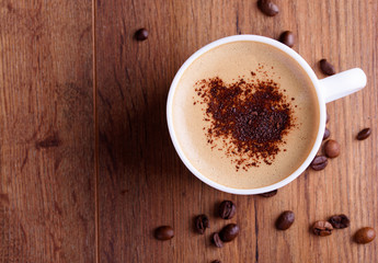 Fragrant coffee on a table with coffee grains