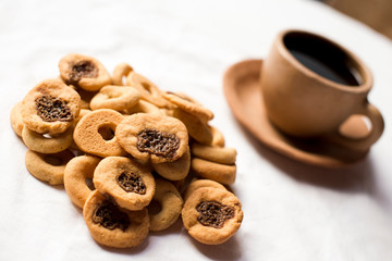 Rosquillas and Viejitas on a white tablecloth. No people. Nicaraguan breakfast.