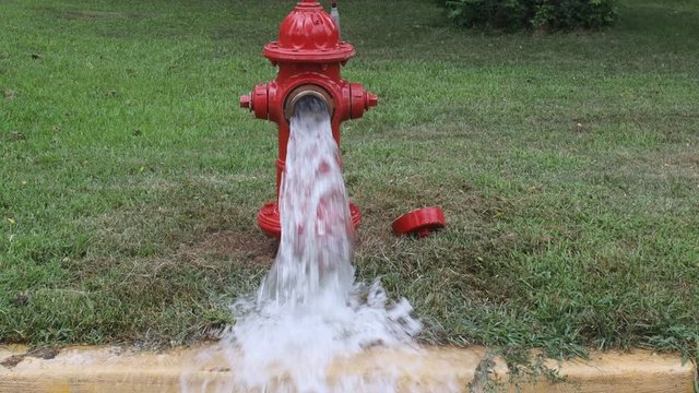 Open in industrial fire hydrant being sprayed strong water