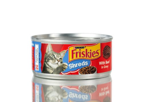 Purina Friskies cat food in tin can isolated on white background with reflection