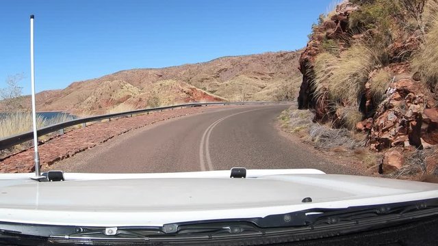 POV (point of view) of Car driving on Lake Argyle Ord River Dam in Kimberley region, Western Australia. 