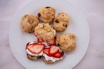 Scones with cream, strawberry and Jam