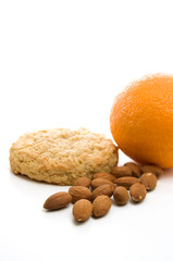 Light Snack of Almonds, Cookie and Orange on White Background