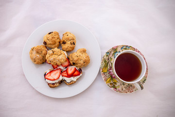 Scones with cream, strawberry and Jam