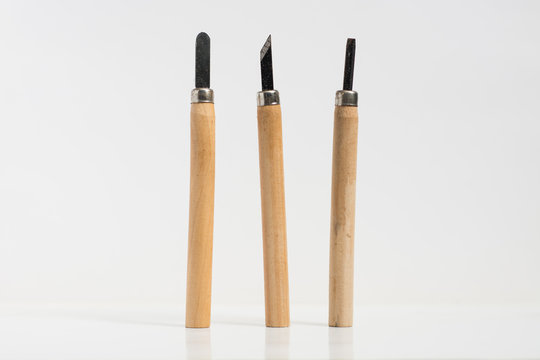 three gouges for wood carving on white isolated background