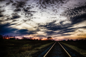 Fototapeta na wymiar sunset over railroad