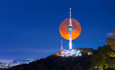  Super full Moon with Seoul tower at night in Seoul, South Korea.