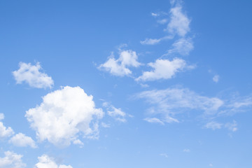 Naklejka na ściany i meble White clouds on a blue sky, nature day.