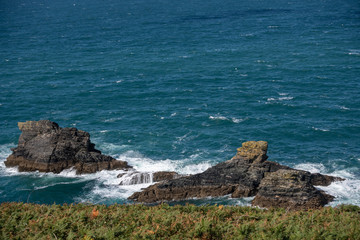Large rock outcrop with waves