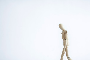 wooden mannequin with hand on head isolated on white