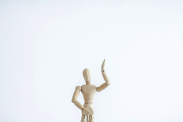 wooden man with hand on head
