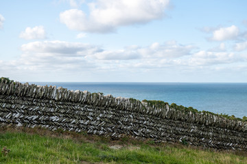 Cloudscape over dry stone wall