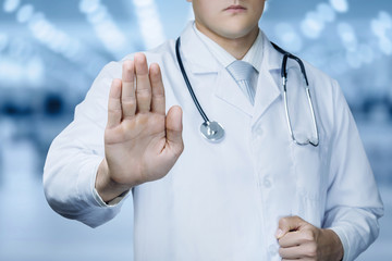 Doctor with forbidden gesture of the hand .