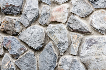 Background of vintage old stone wall texture.