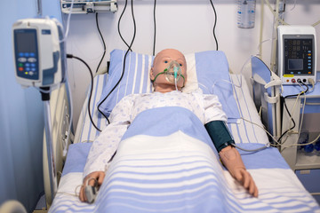 Plastic dummy in the role of a patient used for nurses and medics training - Powered by Adobe