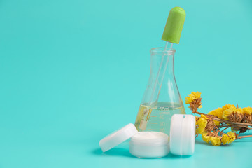 Women's cosmetic products placed on a blue background.
