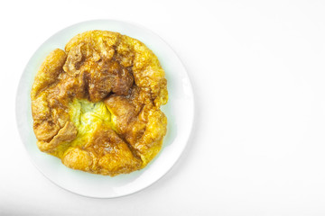 Top view traditional thai style omelet in ceramic plate on white background and copy space.