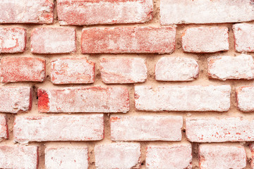 Texture of a brick wall with cracks and scratches which can be used as a background