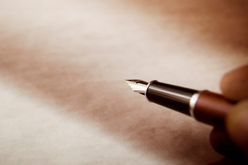 Closeup of hand with fountain pen