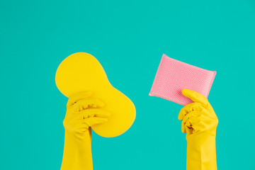 The concept of dishwasher wearing yellow gloves on a blue background.