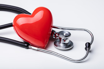 Red Heart And A Stethoscope On Desk